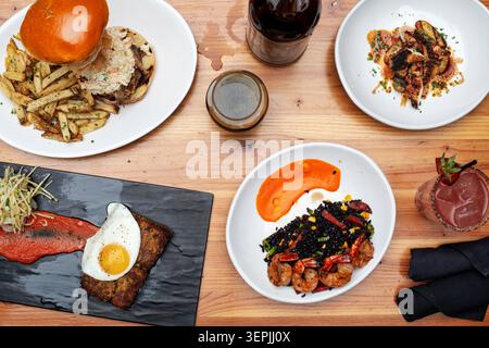 Flat lay of multiple gourmet restaurant dishes Stock Photo