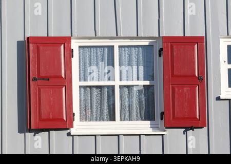 red window on a gray wall, Stock Photo