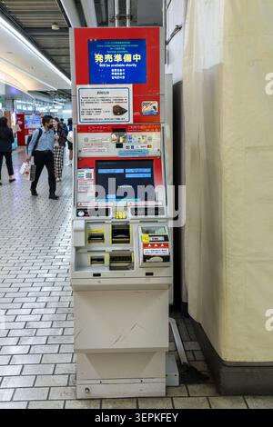 Kyoto, Japan April 20, 2026 ticket vending machine displaying unavailable notice while travelers wait in railway station Stock Photo