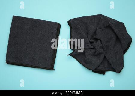 Microfiber cloth for cleaning and dusting on blue background. Top view Stock Photo