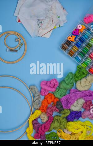 Embroidery and cross stitch accessories.  Set of embroidery equipment on table. Threads and sewing accessories. Stock Photo