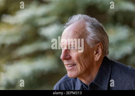 Portrait of smiling senior man outdoors Stock Photo