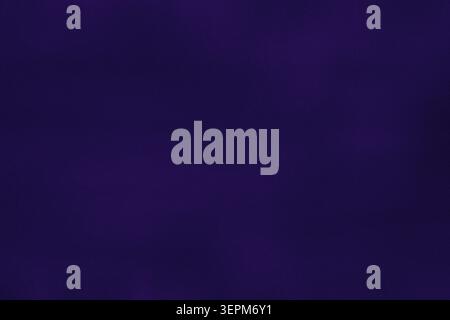 Deep purple gradient background with subtle grain and noise texture. Minimal abstract backdrop with smooth transitions and copy space for modern desig Stock Photo