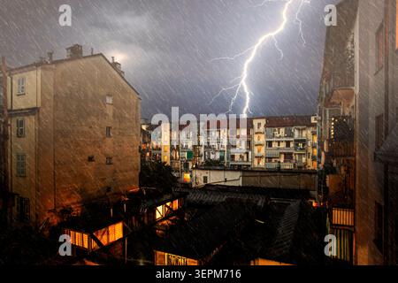 Night thunderstorm over the inner courtyards of the San Salvario district in Turin, Italy Stock Photo