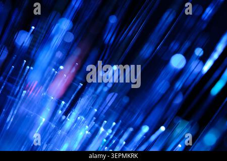 Abstract background with glowing blue and pink fiber optics, fast motion blur and shiny light bokeh Stock Photo