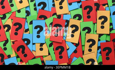 A background filled with a scattered pile of colorful notes featuring black question marks. Close up. Stock Photo