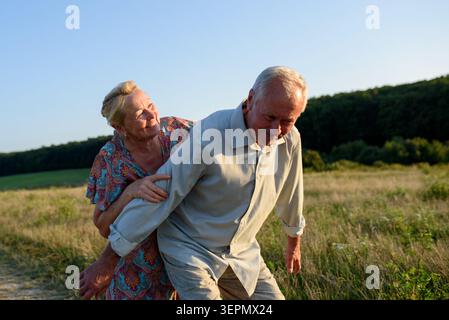 Elderly man and woman spending time in nature. Stock Photo