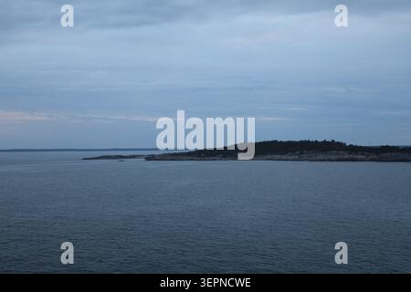 Small rocky islands in the Stockholm archipelago near Nynäshamn, surrounded by calm Baltic Sea waters. Stock Photo