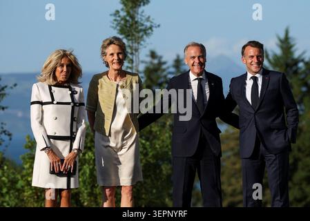 French President Emmanuel Macron and Brigitte Macron pose with Canadian Prime Minister Mark Carney and his wife Diana Fox Carney during the G7 summit in Evian, France. Picture date: Monday June 15, 2026. Stock Photo