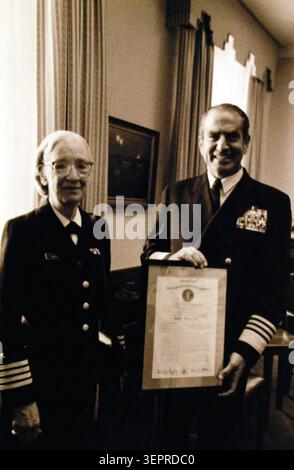 Chief of Naval Operations, presents a certification of promotion to the rank of Captain to Commander Grace Hopper, Stock Photo