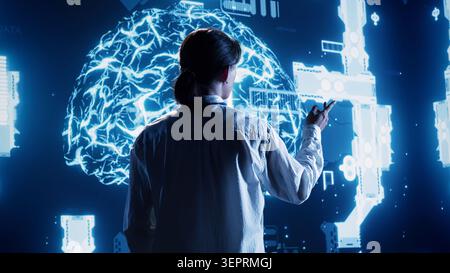 Experienced admin looking at hologram of artificial intelligence cognitive computing human brain simulation. Certified engineer interacting with AR AI visualization showing machine learning algorithms Stock Photo