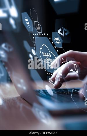Using a laptop to access SaaS technology and tools for business solutions Stock Photo