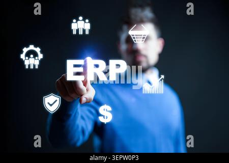 Person selects ERP options on a digital interface in an office setting during daytime Stock Photo