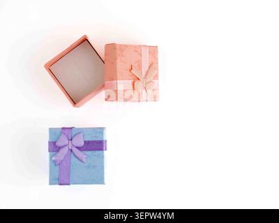 square  jewelry boxes isolated on a white background flat lay peach and blue with ribbon bows Stock Photo