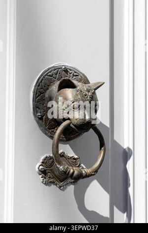 Cat door knocker at a house in Hydra Town, Hydra Island, Saronic Islands, Greece Stock Photo