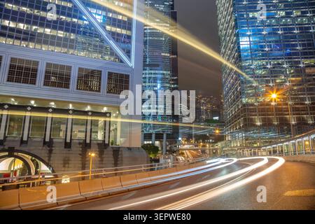 Hong Kong City. Lots of skyscrapers. Night traffic. Only the trails of car headlights are visible Stock Photo