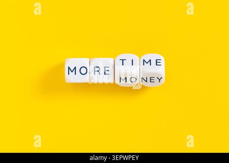 more time more money words written on white blocks on yellow background Stock Photo