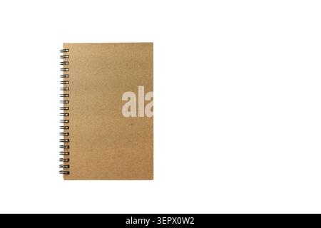 A blank notebook lies flat on a white surface. The notebook has a brown cover and spiral binding. It is empty and ready for notes, sketches, or planni Stock Photo
