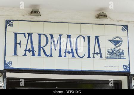 Traditional hand-painted ceramic tile sign for a pharmacy (Farmacia) in Mijas Pueblo, Malaga, Andalusia, Spain. Stock Photo