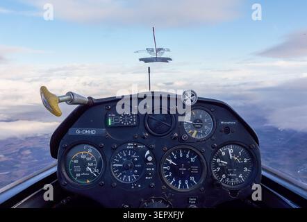 Glider Cockpit View Above the Clouds in Scotland with Flight Instruments and Blue Sky Stock Photo