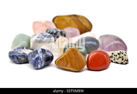Group of different semi-precious gemstone minerals on a white background. Stock Photo