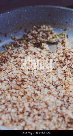 Cooked buckwheat porridge texture background close up. Stock Photo