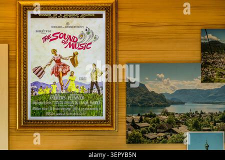 Interior view of the ‘Von Trapp Family Mini Museum’ on the Zwölferhorn near Sankt Gilgen: a framed original poster for the film ‘The Sound of Music’ (directed by Robert Wise, 1965, winner of five Academy Awards including Best Picture) next to a photograph of Lake Wolfgang. The Mini Museum opened at Pentecost 2026 on the Zwölferhorn. Sankt Gilgen, Salzkammergut, Salzburg, Austria Stock Photo
