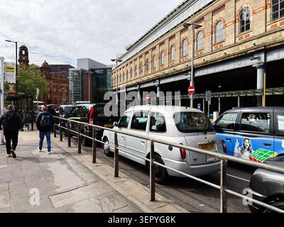 Manchester, UK - May 07, 2026: Repetitive tiled coding text forms a digital programming background evoking software development and developer workspac Stock Photo