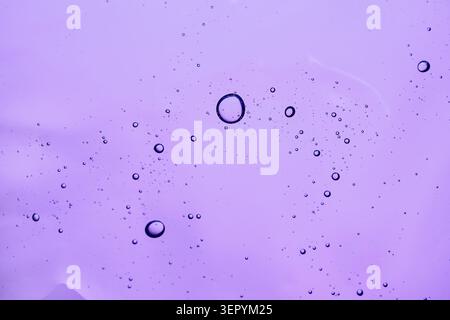 Purple gel texture with bubbles creating an abstract pattern Stock Photo
