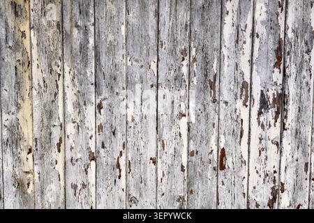 Peeling white paint on wooden shed abstract background Stock Photo