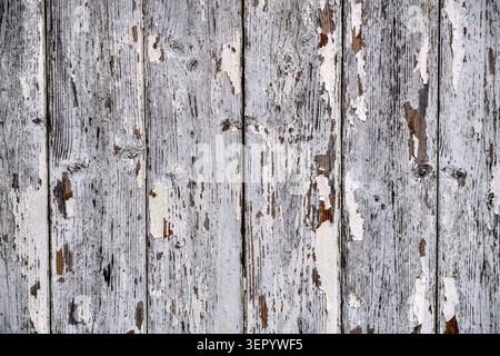 Peeling white paint on wooden shed abstract background Stock Photo