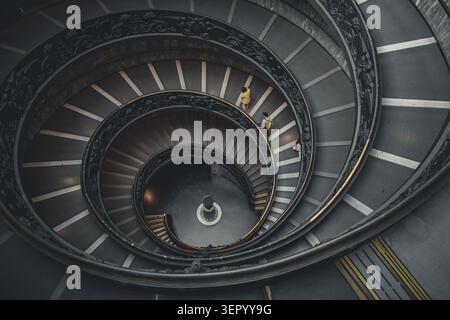 Spiral of Time – Visitors Descending the Vatican Staircase Stock Photo