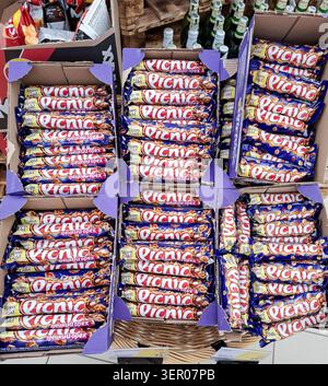 VORONEZH, Russia - March 14, 2026.A large cardboard box contains Alpen Gold Picnic chocolate bars with walnuts on display in a Russian supermarket. Sh Stock Photo