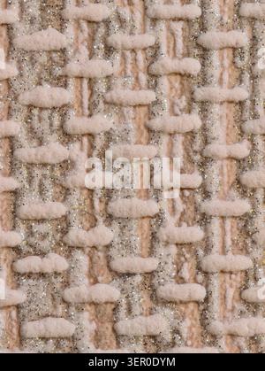 Macro view of beige boucle textile showing a woven pattern of soft looped yarns and flat warp threads. The surface features plush tufted loops, coarse Stock Photo