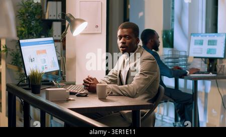 African American manager doing training video in office for newcoming employees. Stock Photo