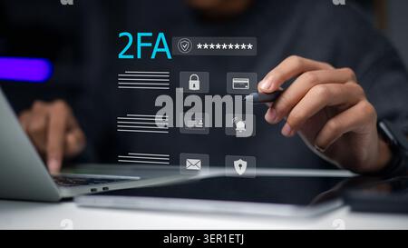 person holding stylus pen near virtual interface showing 2FA text, secured password, lock and shield icons on laptop. Concept of two-factor authentica Stock Photo