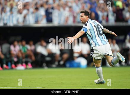 Lionel Andres Messi (Argentina) scores and celebrates his teams third