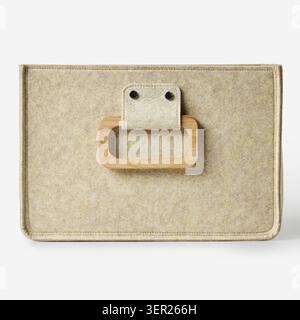 Close-up of a beige felt storage box featuring a wooden handle, ideal for organizing and decluttering Stock Photo