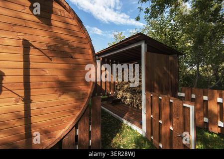 Stacks of Firewood. Preparation of firewood for the winter. Beauty autumn day Stock Photo