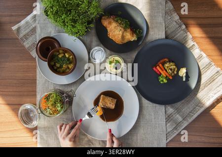 Top view of business lunch - different tasty dishes on the table table from high view angle Stock Photo