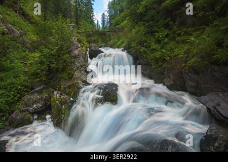 Waterfall in green forest, long exposure Stock Photo