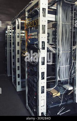 Hallway with a row of servers in server room Stock Photo