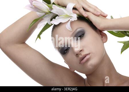Portrait of beautiful dark haired slavonic model posing with flower Stock Photo