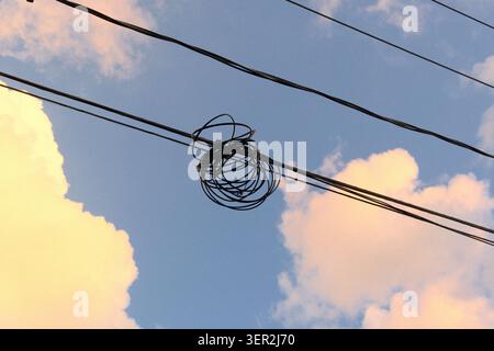 Tangled Power Lines Against Dramatic Sunset Sky with Clouds — Urban Infrastructure Abstract Stock Photo
