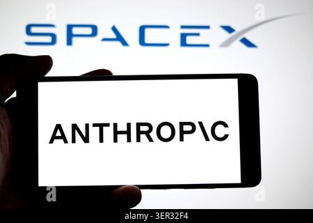 In this photo illustration, an Anthropic logo is seen displayed on a smartphone with a Space X logo in the background. (Photo by Avishek Das / SOPA Images/Sipa USA) *** Strictly for editorial news purposes only *** Stock Photo