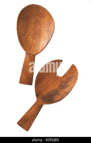 Wooden salad servers set with spoon and fork isolated on white background. Top view of eco kitchen utensils. Stock Photo