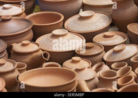 Many earthen pots kept for drying in the sun Stock Photo