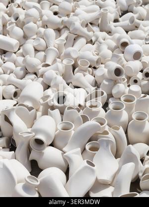 Many earthen pots kept for drying in the sun Stock Photo