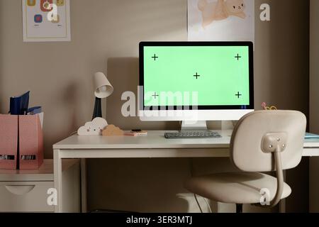 Desk Featuring Computer Mockup for Online Learning Stock Photo