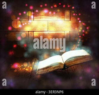 Old book with magic Ray of light Stock Photo